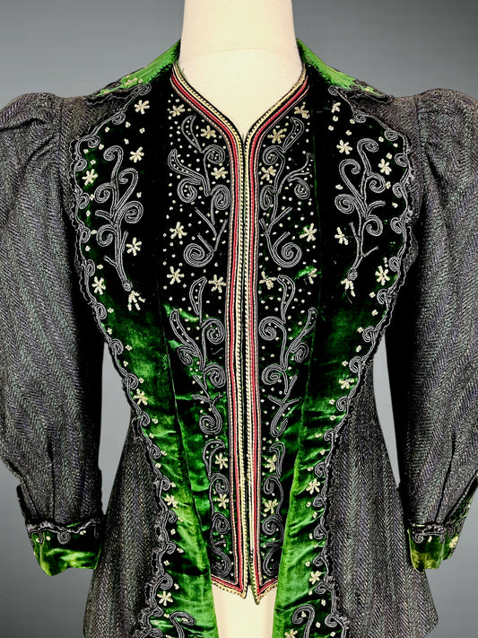 Detail of emerald green velvet trim with soutache embroidery and beaded snowflake motifs on Victorian bodice