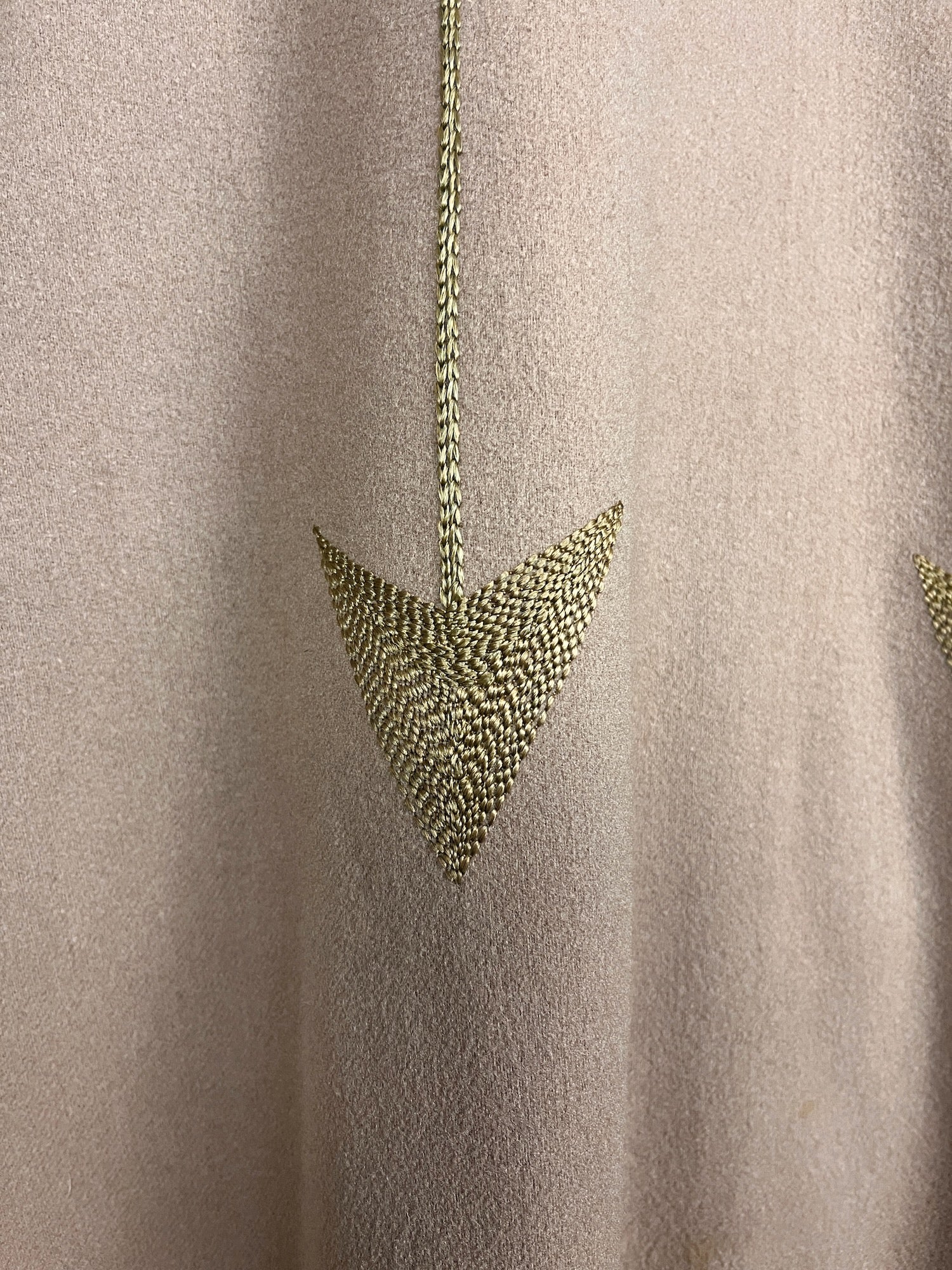 close-up of silk floss embroidered arrow point