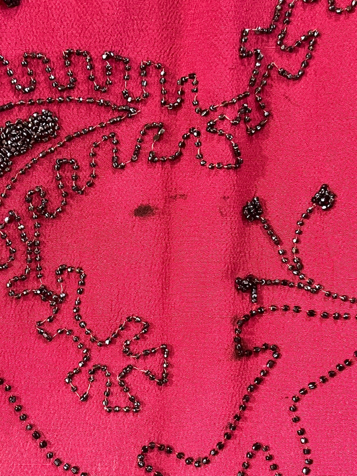 close-up of charcoal surface spot on lower front skirt