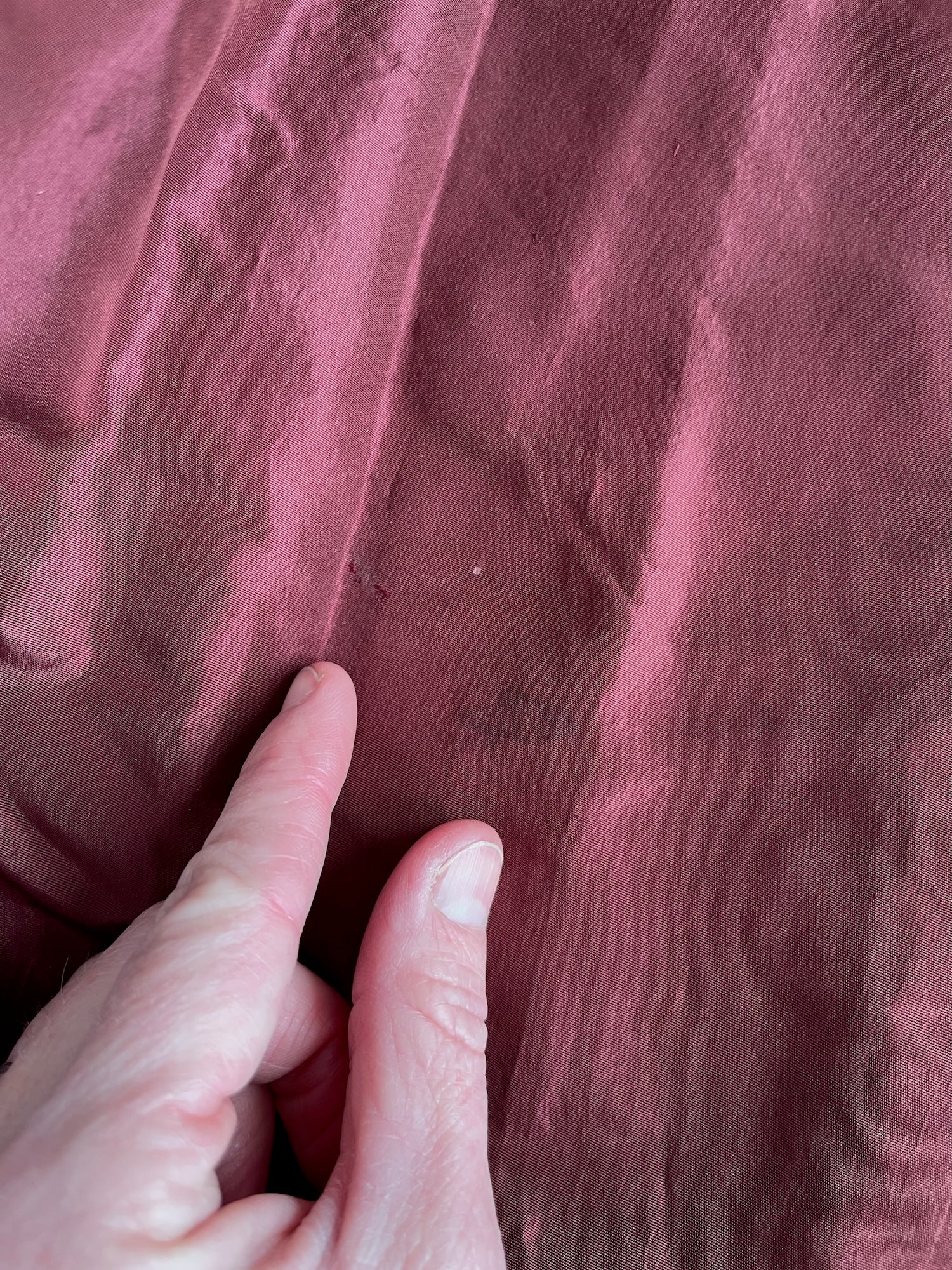 Dark spot and slightly glazed spot on skirt