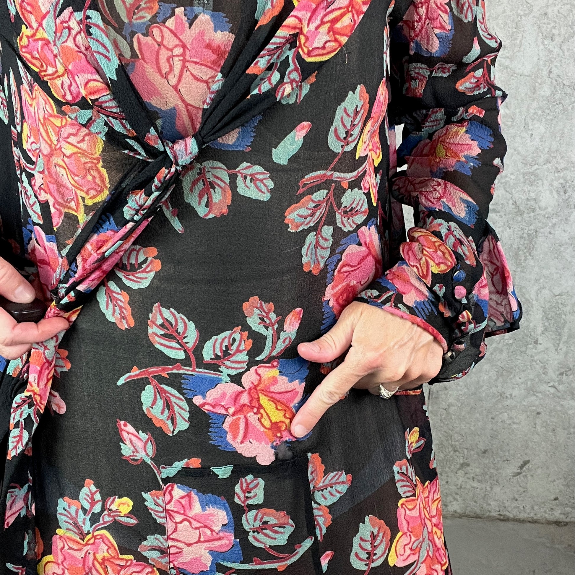Finger pointing to front mesh patch