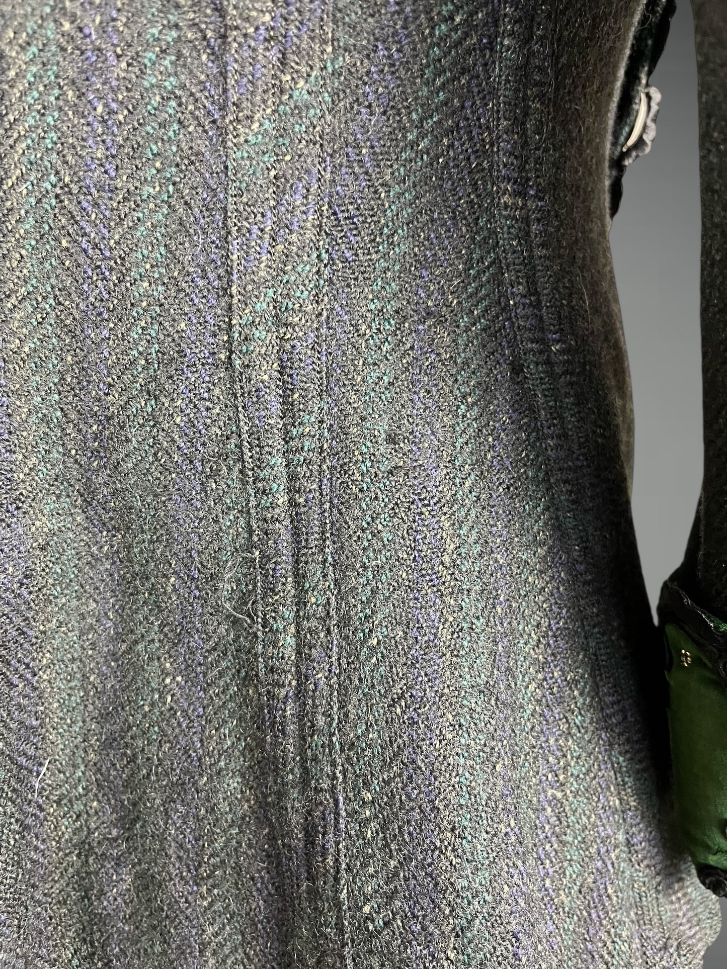 close-up of textured wool pattern and wear / darning