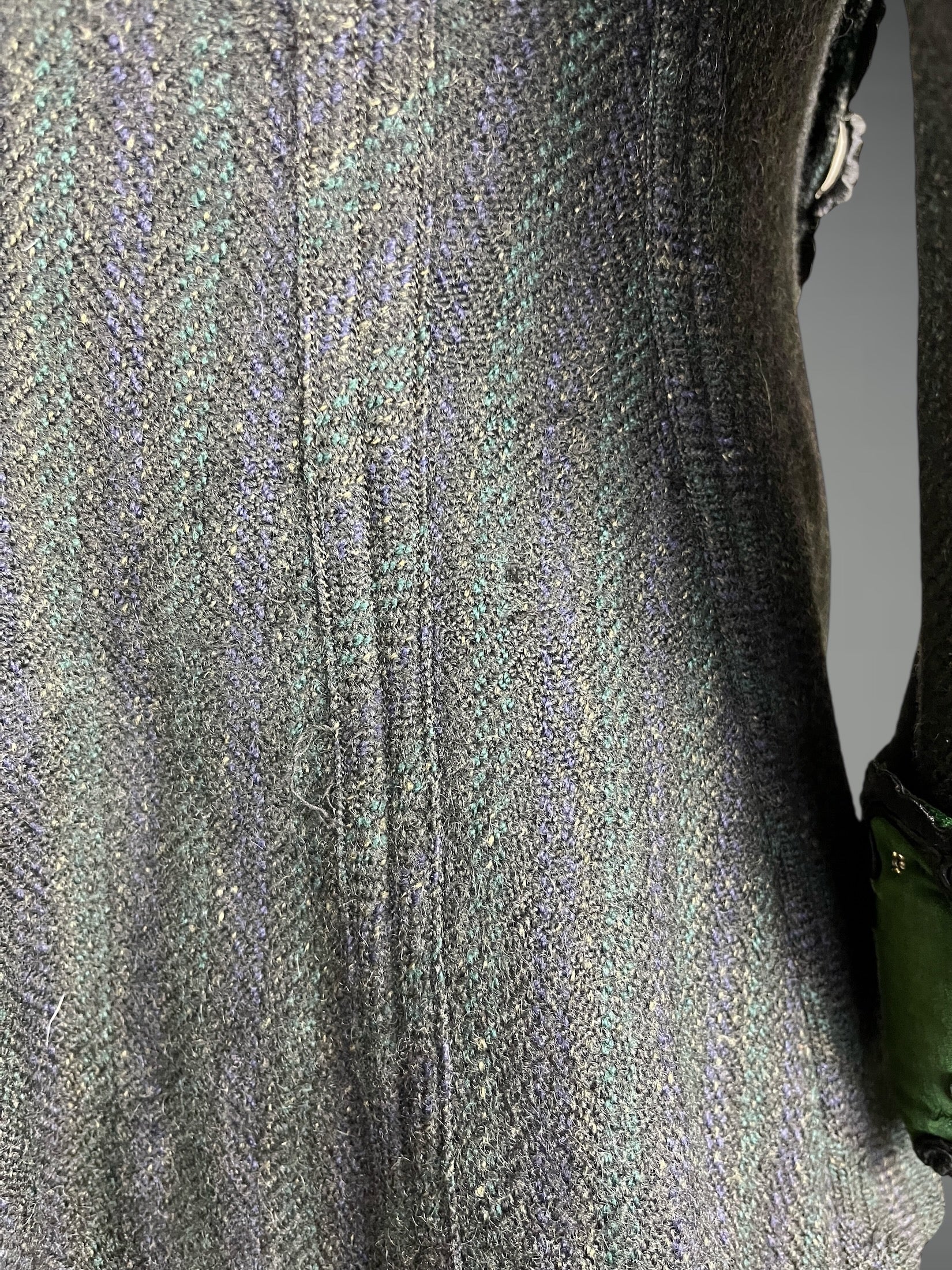 close-up of textured wool pattern and wear / darning