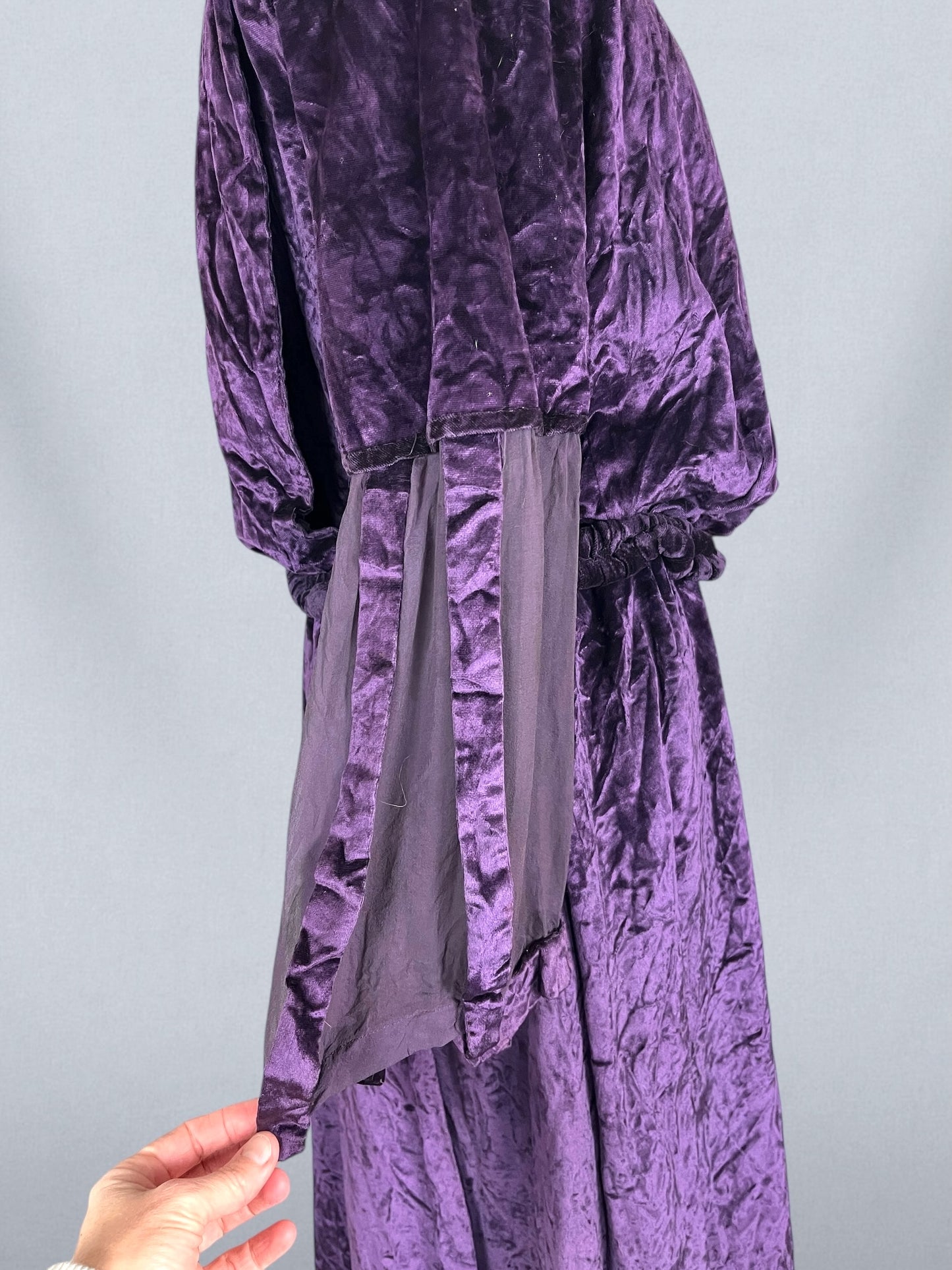 Close-up of sheer chiffon sleeves with cutout velvet detail