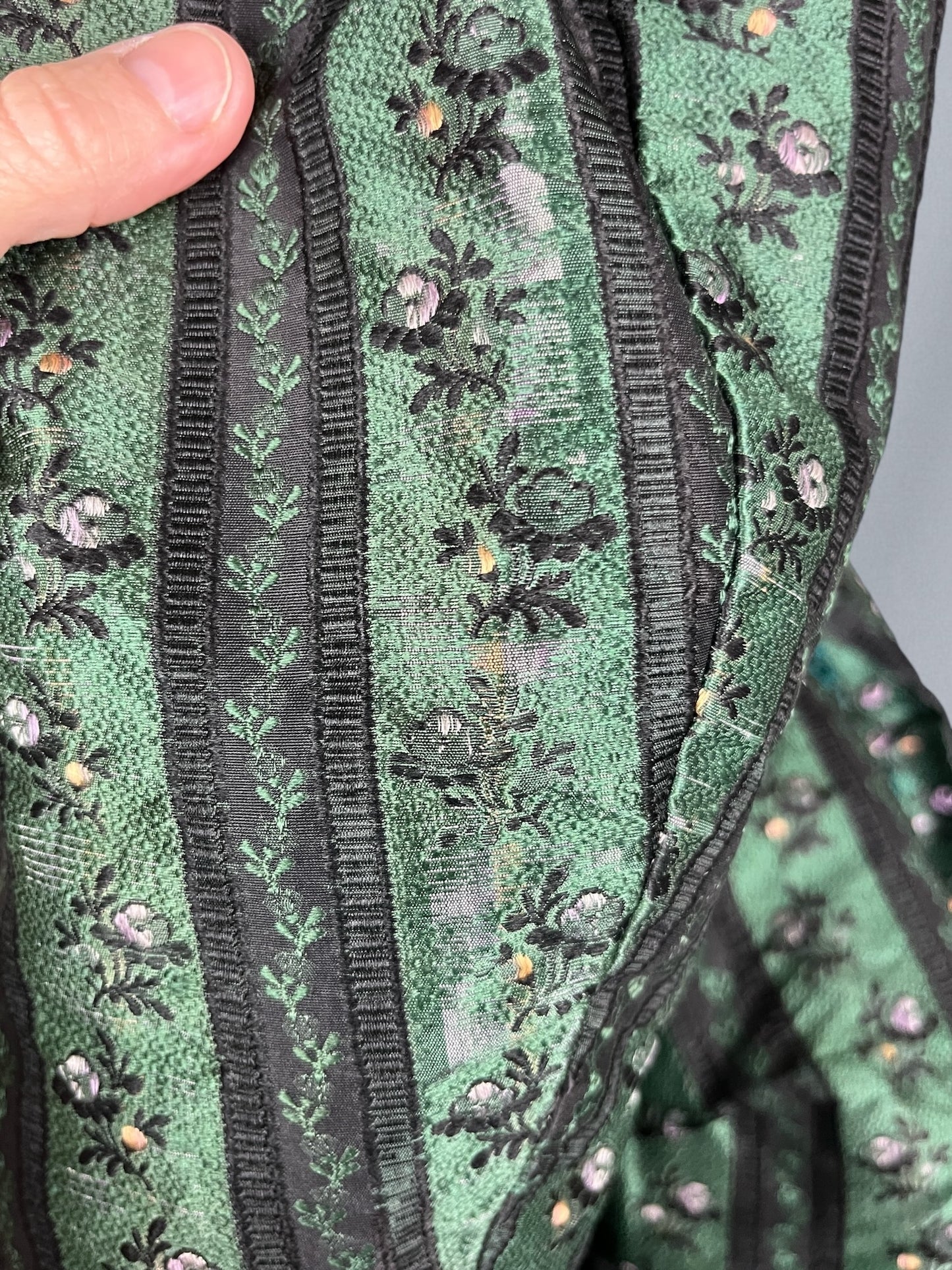 minor wear to silk at sleeve